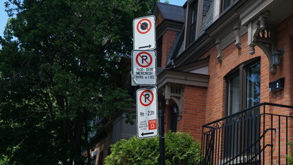 Montreal, QC/ Canada - 6/24/2020: Parking challenge in downtown. No Parking signs: middle...