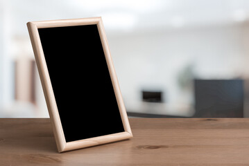 photo frame on the wooden table