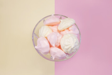 
multi-colored meringues on a plain background