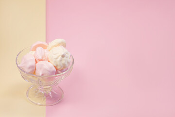 
multi-colored meringues on a plain background