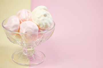 
multi-colored meringues on a plain background