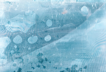 Blue abstract background. Steamed window. Weathered scratched glass with water drops.