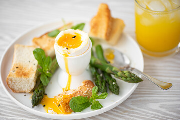 breakfast with poached egg, asparagus and toasted bread
