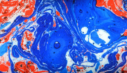 Splash of paint. closeup abstract color mixing of water, acrylic,oil and milk for use as background image. Acrylic texture with beautiful pattern, multi color background photo. 