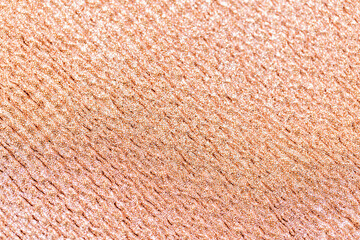party, texture and holidays concept - rose gold glitter background
