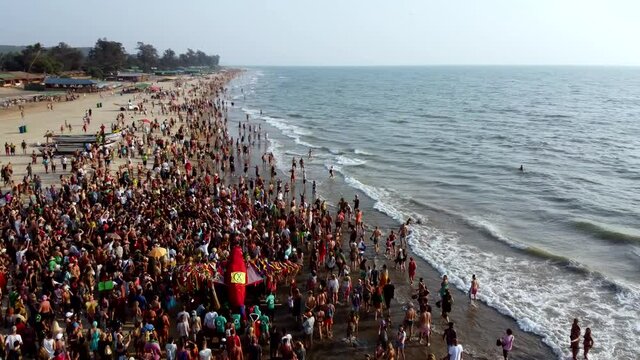 Arambol Goa India Freak Parade Carnival at the sunset beach drone fly over
