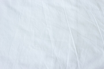 Fototapeta na wymiar Top view of white fabric bed sheet texture background.