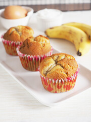 Close up healthy homemade banana cake in white plated on white fabric background. .