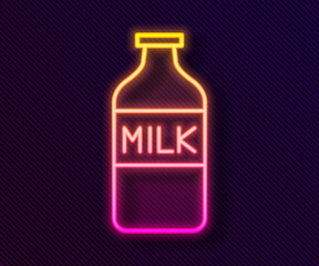 Glowing neon line Closed glass bottle with milk icon isolated on black background. Vector Illustration.