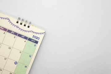 Close up of calendar on white background, business planning or travel planning concept. There are  copy space..