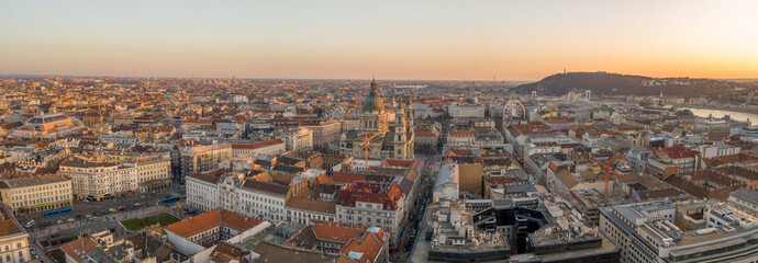 Panoramic aerial drone shot of St. Stephen Basilica during Budapest sunset hour in winter