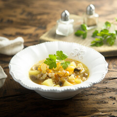 Traditional homemade mushroom soup with fresh parsley