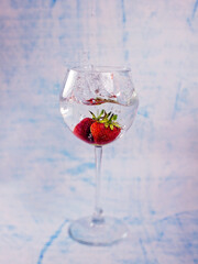 Strawberries in a glass in water