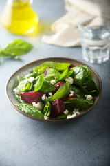 Healthy spinach salad with beetroot and cheese