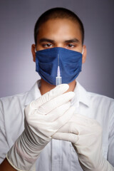 doctor with mask and syringe