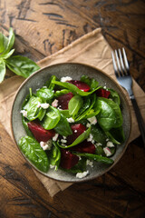Healthy spinach salad with beetroot and cheese