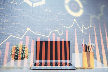 Double exposure of forex chart and work space with computer. Concept of international online trading.