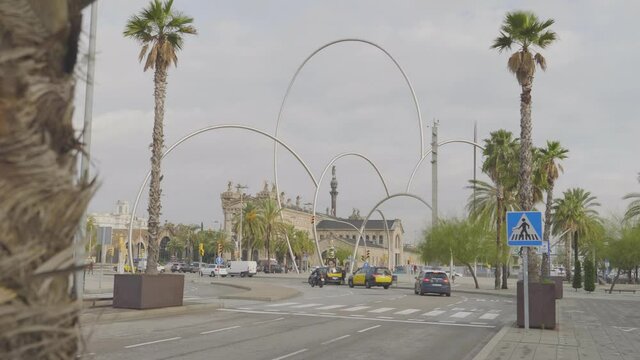 A long view of Aduana, Customs building at Barcelona harbour, Catalonia, Spain over the trees at the highway.