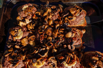 Stockholm, Sweden  Hamburgers topped with mushrooms diret from the oven.