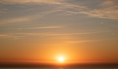 Fototapeta na wymiar Beautiful scenic view of sunset or sunrise over the ocean.