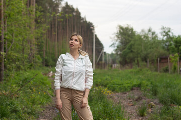 Young girl in the woods girl walks in the forest. Happy, outdoor.
