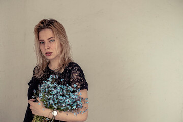 girl with white hair with the flower in hands