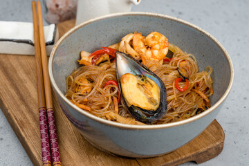 Fungose salad with seafood in a plate