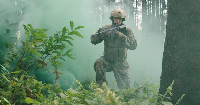 Concept of military or army action in forest with smoke in background