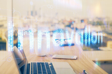 Double exposure of desktop computer and technology theme hologram. Concept of software development.