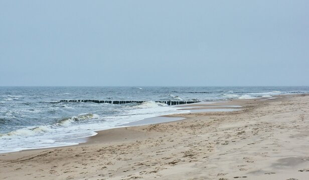 Beach with small sea waves in Sarbinowo, Poland