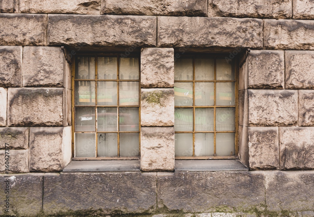 Wall mural Windows on an old block wall