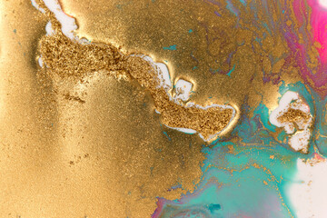Golden glitter scattering background. Sparkling gold and blue texture. Copyspace.
