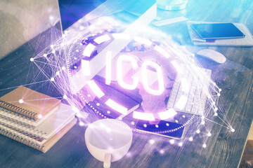 Double exposure of blockchain and crypto economy theme hologram and table with computer background....