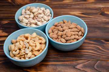 Dried nuts. Almonds, pistachios, cashews. Assorted nuts. Flat lay