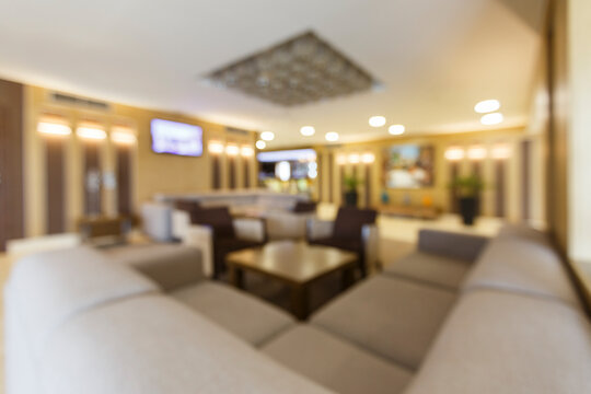 Blurred photo of hotel lobby with big heart corner sofa