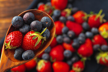 Close up photo of blueberries and strawberries