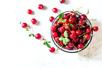 Close up image of sweet cherry on a light concrete background.
