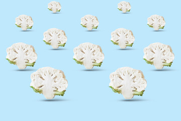 Cauliflower on blue background. Seamless minimalistic isometric pattern, photo collage, vegan pop art design, vegetable backdrop. Postcard, print on fabric, wrapping paper.