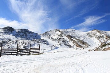 Fototapeta na wymiar Bright blue sky sunny day snow on top of mountain. photo 