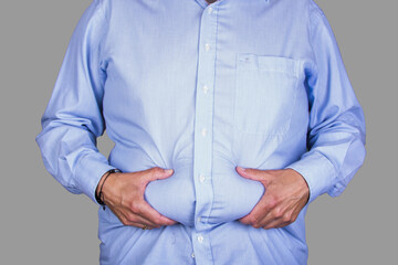 man with overweight and a big belly wearing  a shirt, holding his wheatwamp