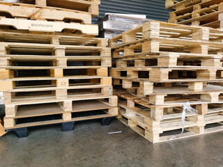 Wooden pallets stack at the freight cargo warehouse for transportation and logistics industrial 