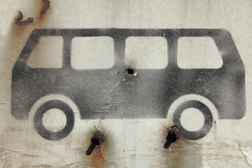 Sign and symbol of bus or public transport in black on white. Rusty vehicle sign at an abandoned...