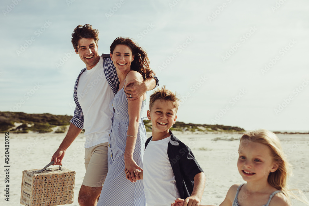 Wall mural family at beach on weekend