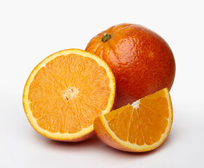 Red orange and slices of it isolated on white background.