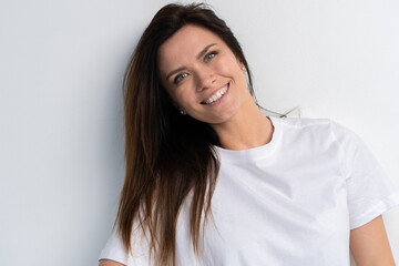 Fototapeta premium Funny woman on white background. Cheerful female model joyful. Positive human emotion facial expression body language