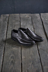 black loafers on a wooden