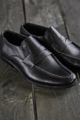 black loafers on a wooden