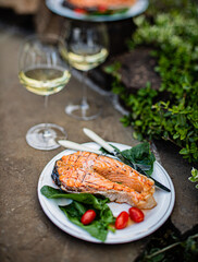 grilled salmon with salad and wine