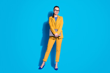 Full length photo of attractive business lady worker hold laptop online meeting wear spectacles...
