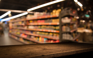 Empty wood table top on blurred market fruit. can montage or display your products